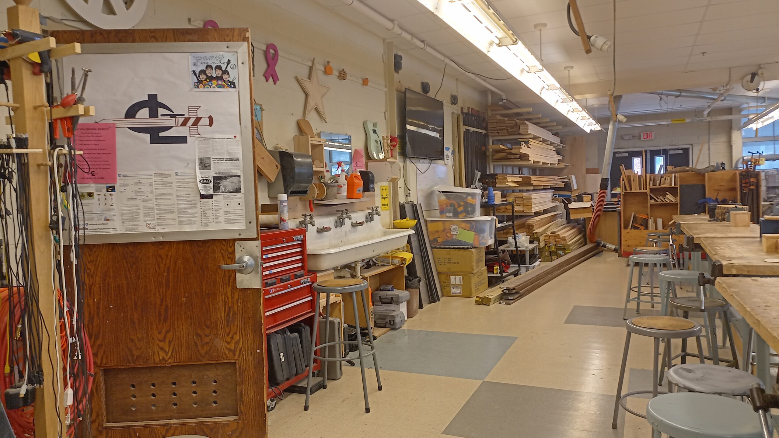 Another wide view of the technology and woodworking room showing storage, sinks, and work areas