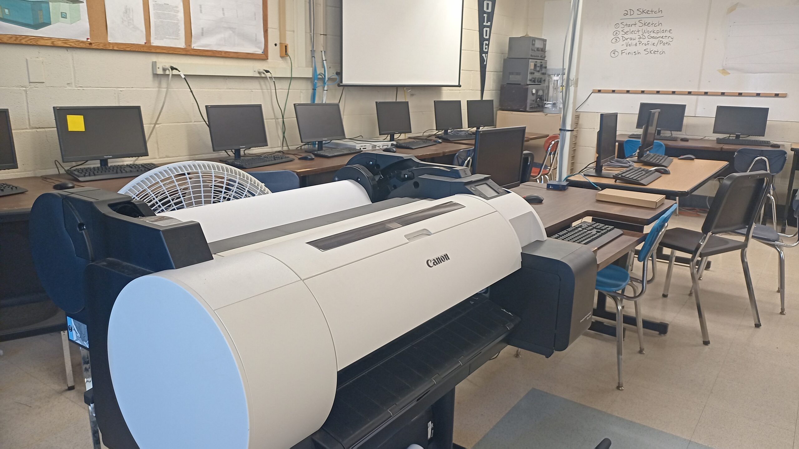 Computer stations and large format printer in the classroom