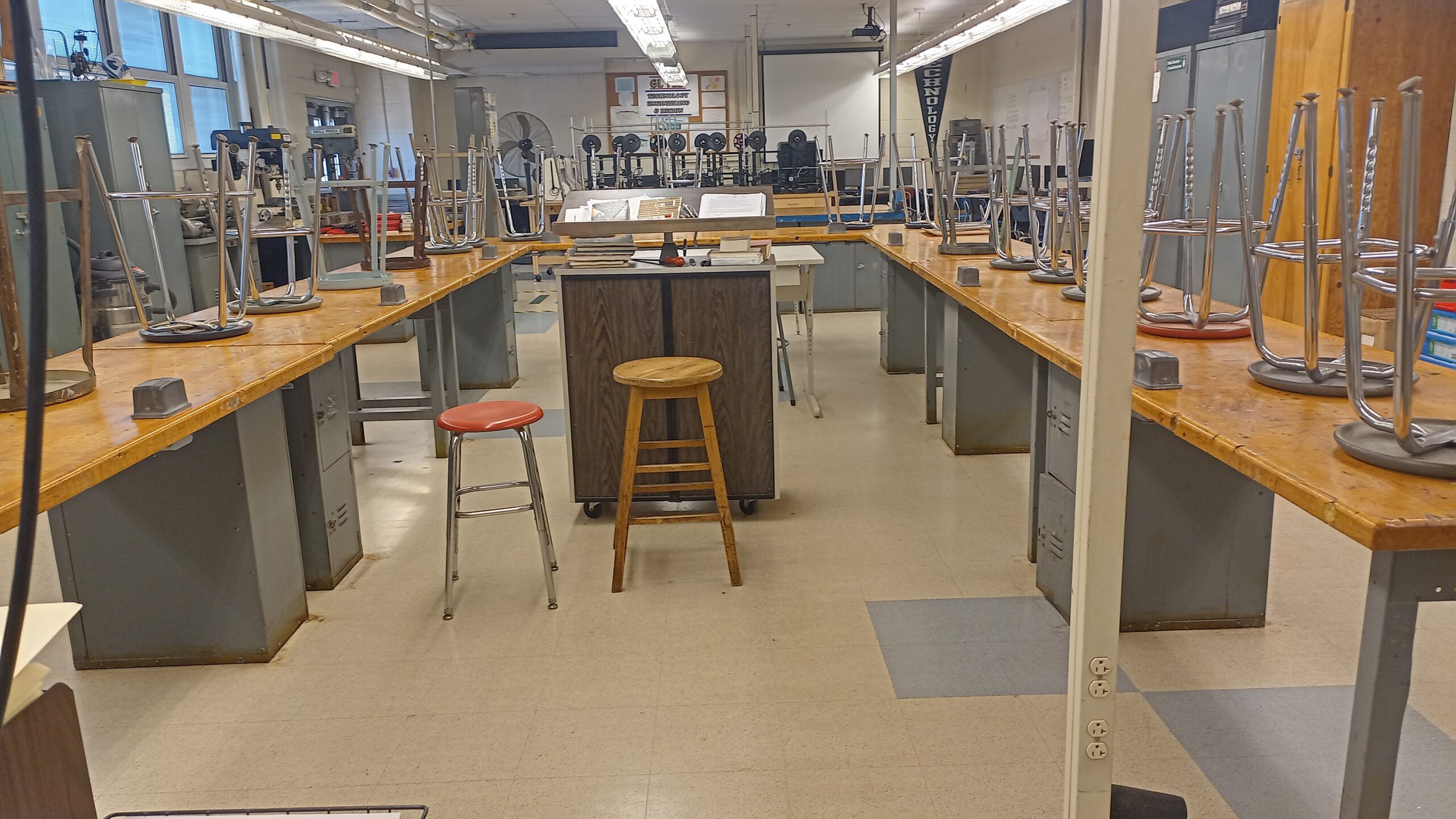 Tables and open work area inside the technology classroom